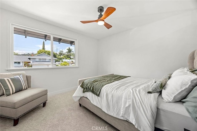 bedroom featuring carpet flooring, baseboards, and ceiling fan