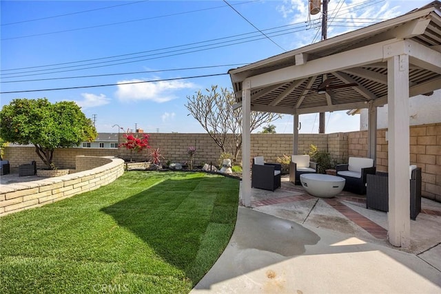 view of yard with a patio, a gazebo, a fenced backyard, and an outdoor hangout area