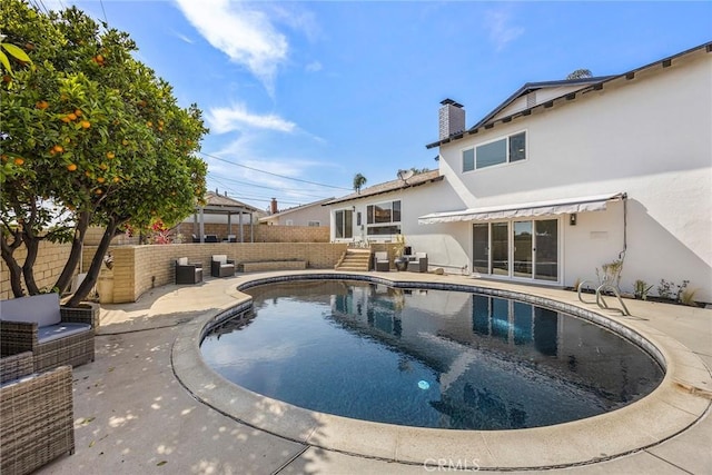 view of swimming pool featuring a fenced in pool, a fenced backyard, and a patio area