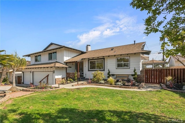 tri-level home featuring a chimney, a garage, fence, a front lawn, and concrete driveway