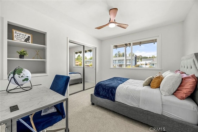 bedroom featuring a closet, carpet flooring, and ceiling fan