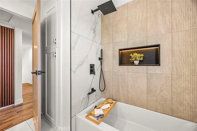 bathroom with walk in shower and a bath
