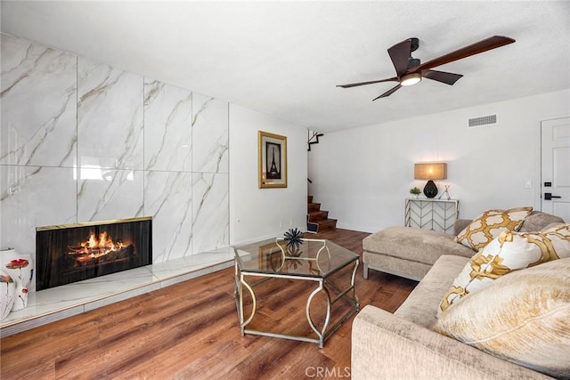 1110 Arbolita Dr, La Habra, CA 90631 - living area with a ceiling fan, stairway, wood finished floors, a fireplace, and baseboards