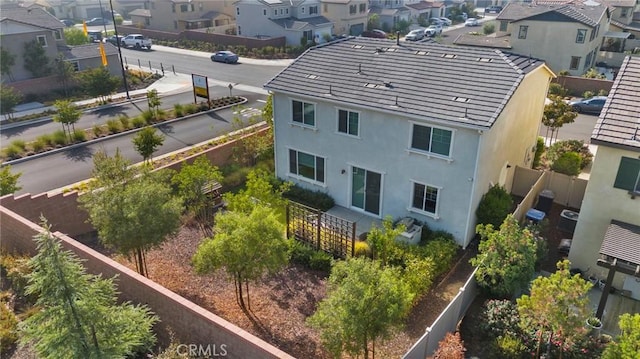 birds eye view of property with a residential view