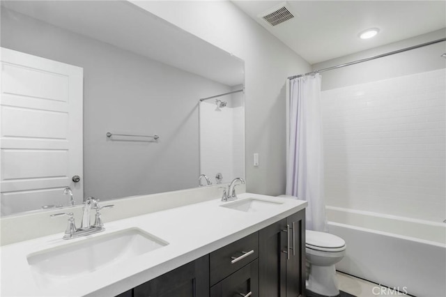 full bathroom featuring a sink, shower / bathtub combination with curtain, toilet, and visible vents