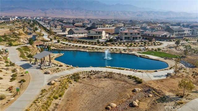 aerial view with a water and mountain view and a residential view
