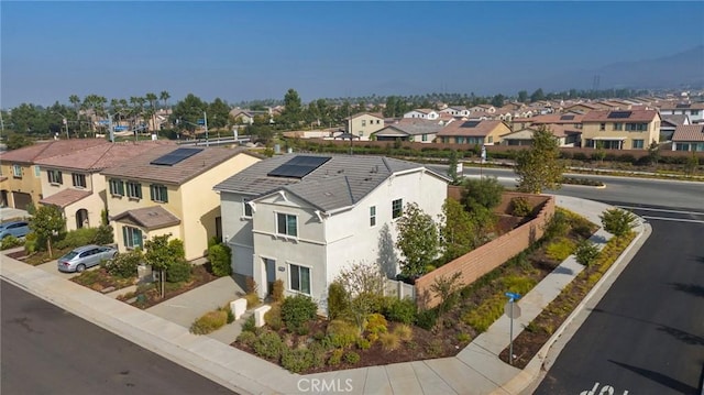 birds eye view of property with a residential view