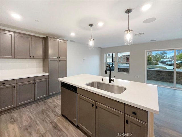 7155 Citrus Ave Unit 344, Fontana, CA 92336 - kitchen with stainless steel dishwasher, a sink, light wood-type flooring, pendant lighting, and light countertops