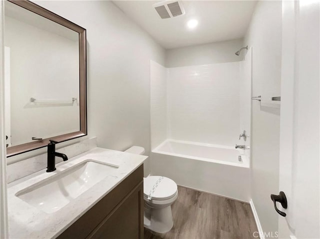 7155 Citrus Ave Unit 344, Fontana, CA 92336 - bathroom featuring toilet, wood finished floors, vanity, and tub / shower combination