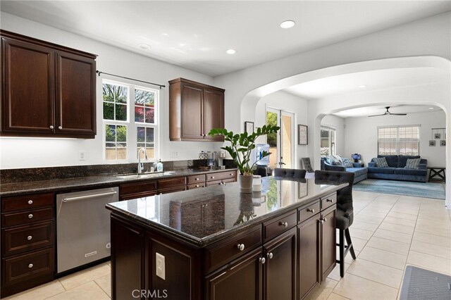 1526 Cole Ln, Upland, CA 91784 - kitchen featuring stainless steel dishwasher, a sink, arched walkways, healthy amount of natural light, and recessed lighting