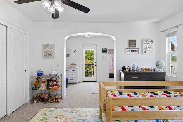 1526 Cole Ln, Upland, CA 91784 - carpeted bedroom with arched walkways, ceiling fan, a closet, and access to exterior