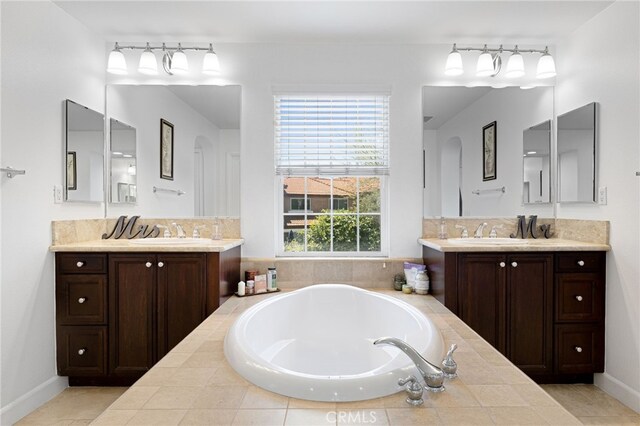 1526 Cole Ln, Upland, CA 91784 - full bath featuring two vanities, a bath, and baseboards