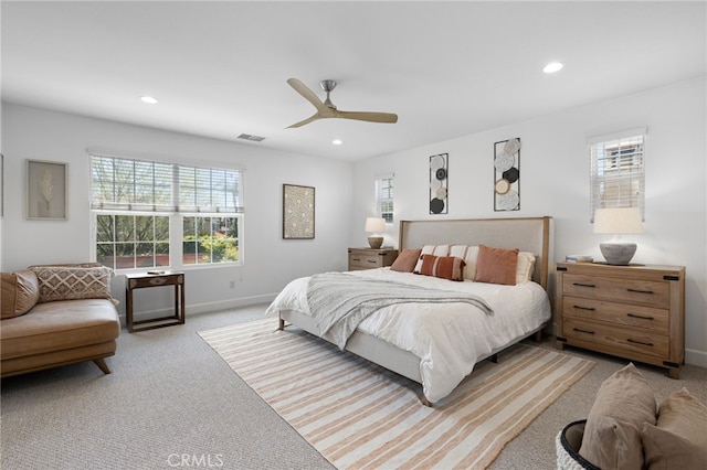 carpeted bedroom with multiple windows, recessed lighting, baseboards, and ceiling fan