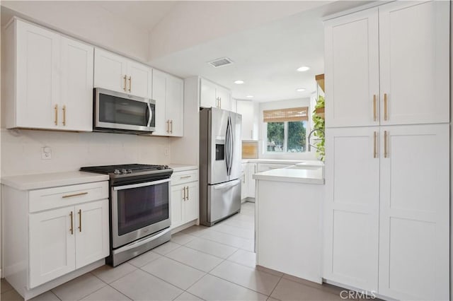 kitchen featuring visible vents, light countertops, white cabinetry, and appliances with stainless steel finishes