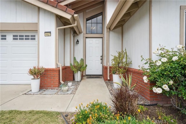 view of exterior entry with an attached garage