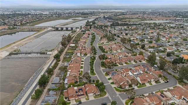 bird's eye view with a residential view and a water view