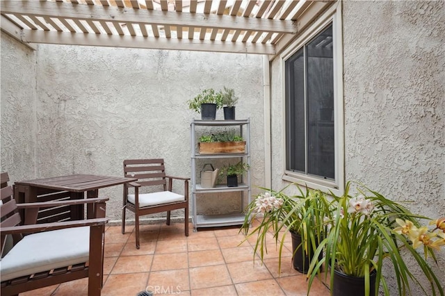 balcony with a pergola and a patio area