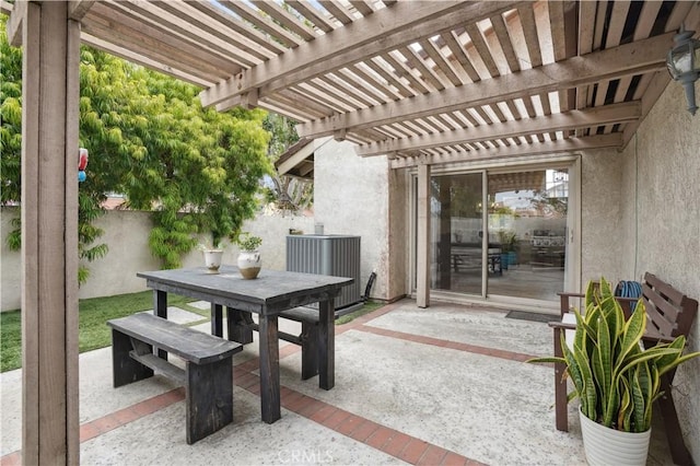 view of patio / terrace featuring fence, outdoor dining space, a pergola, and central air condition unit