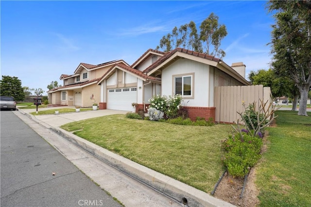 view of front of home with a garage, a front lawn, fence, and driveway