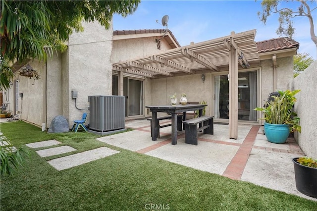 back of property featuring a patio, cooling unit, a yard, a pergola, and stucco siding
