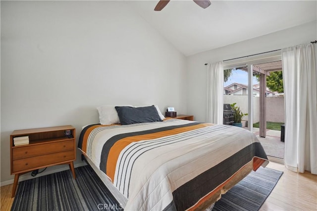 bedroom with access to outside, ceiling fan, high vaulted ceiling, baseboards, and wood finished floors