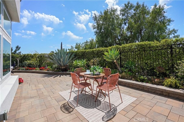 view of patio / terrace with a fenced backyard and outdoor dining space