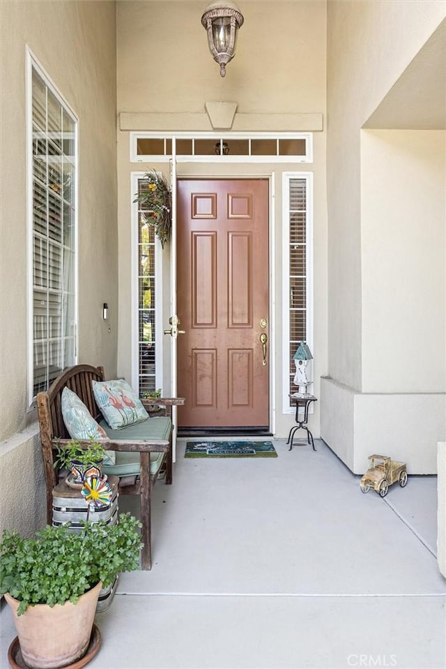 1042 Sleepy Hollow Rd, Paso Robles, CA 93446 - view of exterior entry with stucco siding and a porch