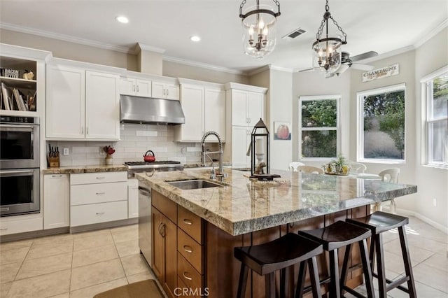 1042 Sleepy Hollow Rd, Paso Robles, CA 93446 - kitchen featuring a sink, appliances with stainless steel finishes, under cabinet range hood, light tile patterned floors, and recessed lighting