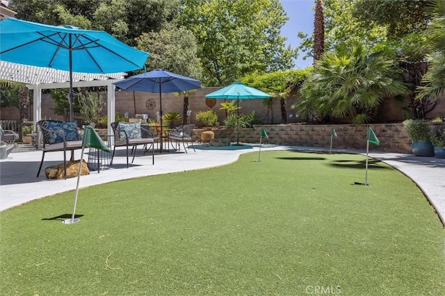 1042 Sleepy Hollow Rd, Paso Robles, CA 93446 - view of property's community featuring a putting area, a patio area, and fence