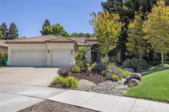 1042 Sleepy Hollow Rd, Paso Robles, CA 93446 - view of front of property featuring an attached garage, driveway, a tile roof, stucco siding, and a front yard