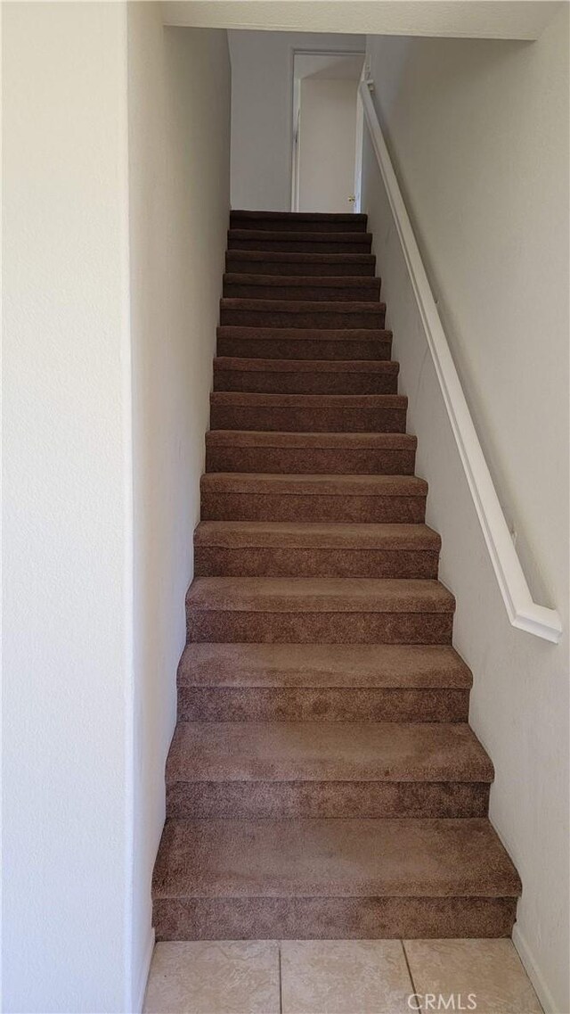 28799 Lavatera Ave, Murrieta, CA 92563 - staircase with tile patterned floors