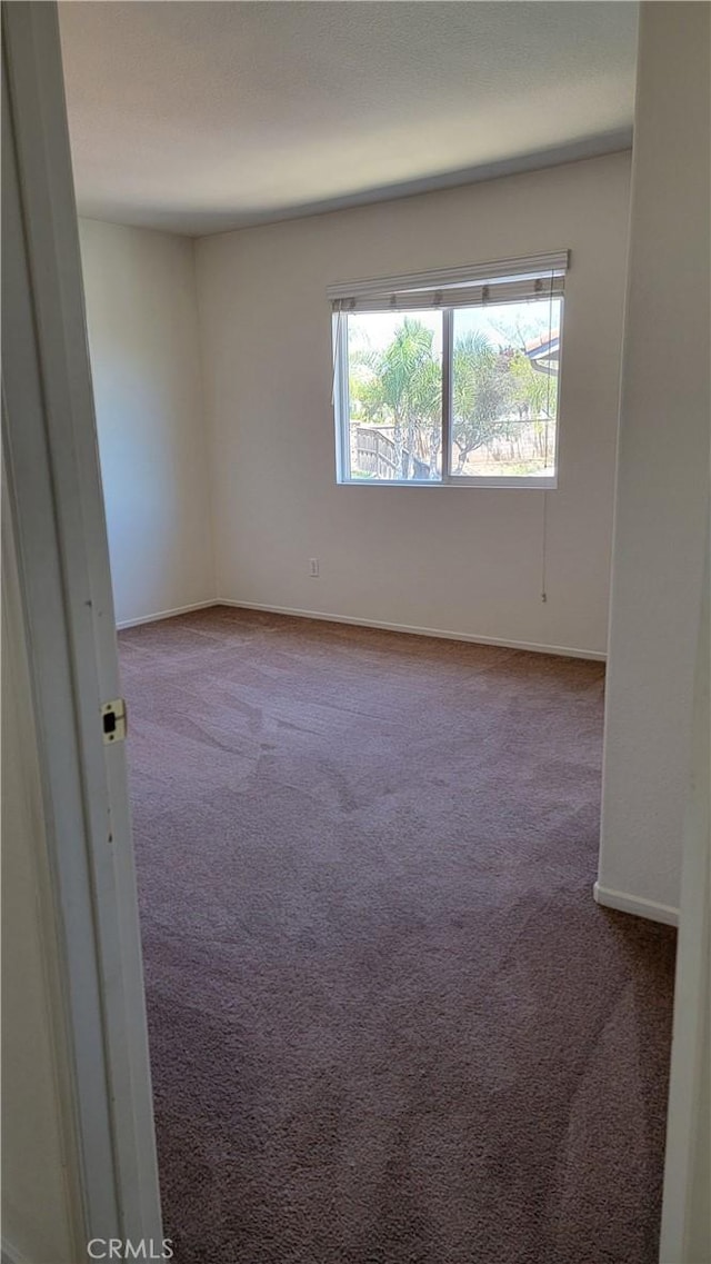 28799 Lavatera Ave, Murrieta, CA 92563 - empty room with carpet floors and baseboards