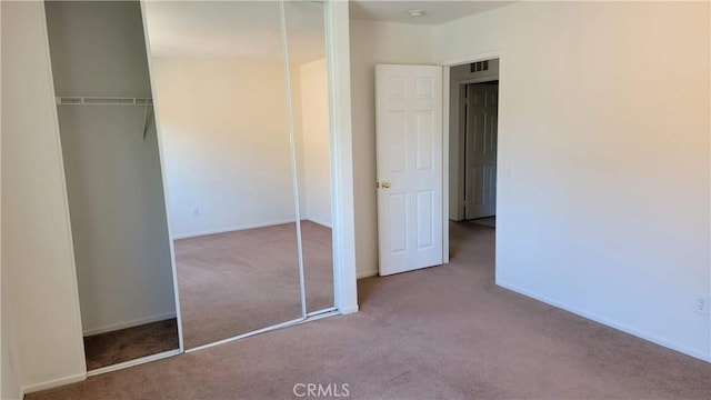 28799 Lavatera Ave, Murrieta, CA 92563 - unfurnished bedroom featuring carpet floors, baseboards, and a closet