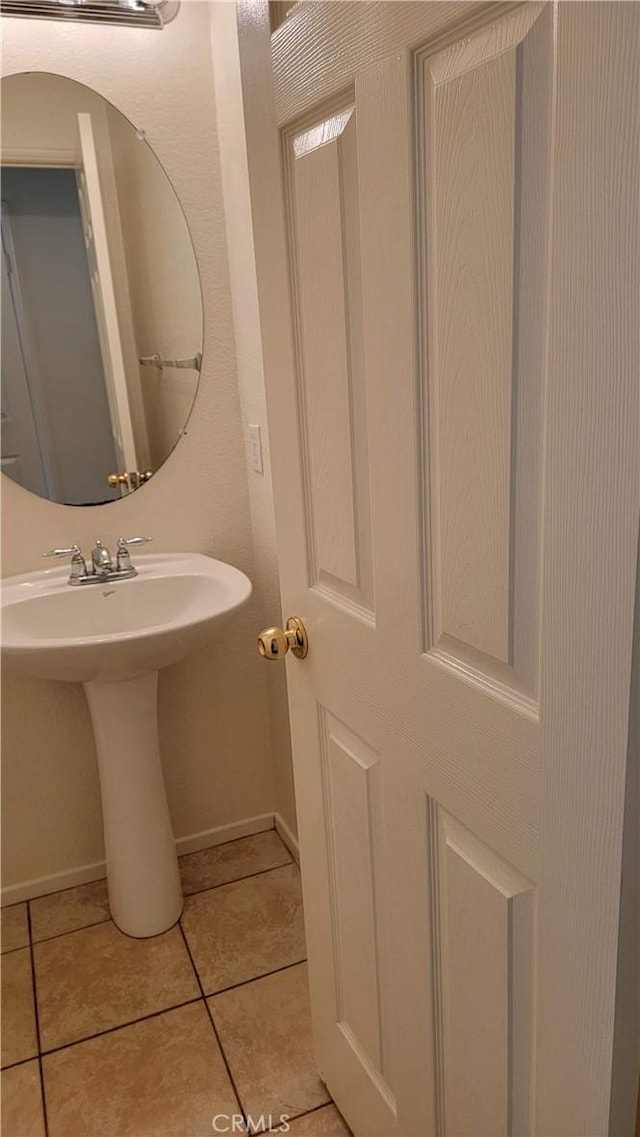 28799 Lavatera Ave, Murrieta, CA 92563 - bathroom with baseboards and tile patterned floors