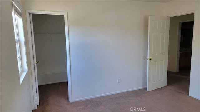 28799 Lavatera Ave, Murrieta, CA 92563 - unfurnished bedroom with carpet floors, baseboards, a spacious closet, and a closet