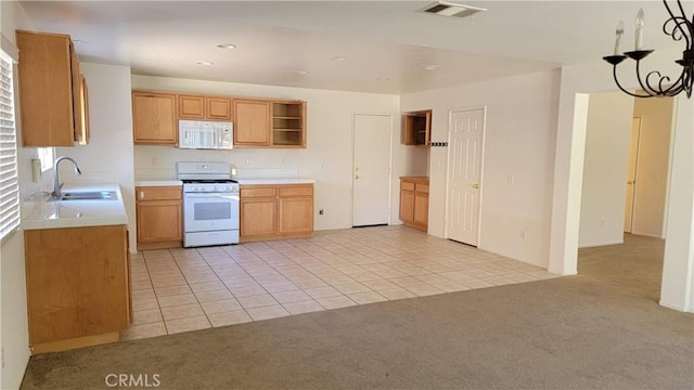 28799 Lavatera Ave, Murrieta, CA 92563 - kitchen with open shelves, light carpet, a sink, white appliances, and visible vents