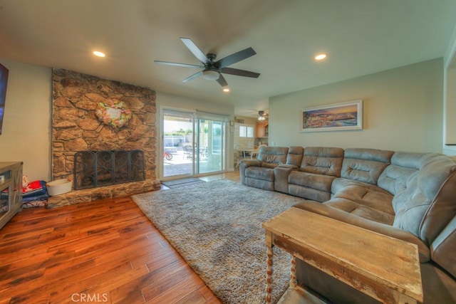 living room featuring a ceiling fan, hardwood / wood-style floors, a fireplace, and recessed lighting