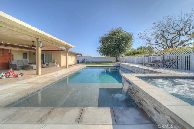 view of swimming pool featuring an in ground hot tub, outdoor lounge area, a fenced backyard, a patio area, and a fenced in pool