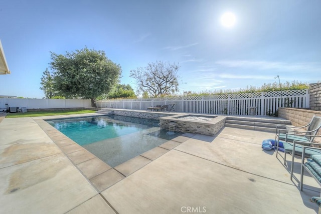 view of swimming pool with a fenced backyard, an in ground hot tub, a patio, and a fenced in pool