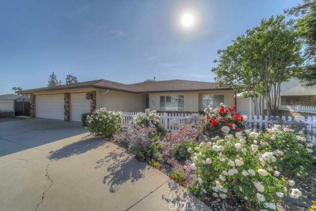 5315 Wheeler Ave, La Verne, CA 91750 - ranch-style home featuring a garage, fence, driveway, and stone siding