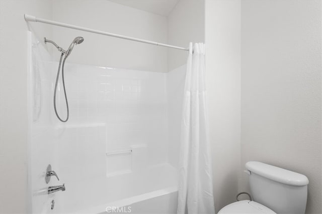 full bathroom featuring shower / tub combo and toilet