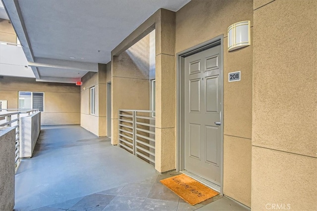 property entrance featuring stucco siding