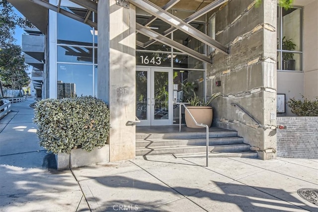 property entrance featuring french doors