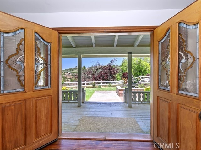 35280 Stage Rd, Temecula, CA 92592 - entryway with dark wood finished floors, beam ceiling, and a healthy amount of sunlight