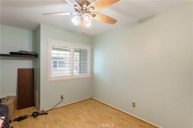 unfurnished bedroom featuring baseboards, ceiling fan, and wood finished floors