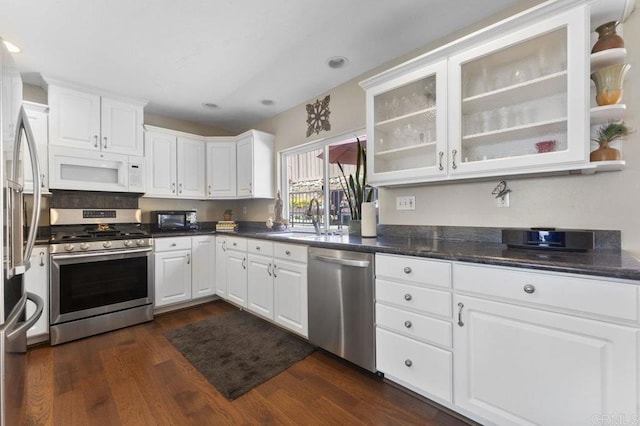 4331 Summit Dr, La Mesa, CA 91941 - kitchen with appliances with stainless steel finishes, white cabinetry, dark wood-style floors, a sink, and recessed lighting