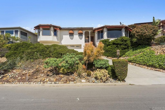 4331 Summit Dr, La Mesa, CA 91941 - mediterranean / spanish-style house featuring stucco siding and an attached garage