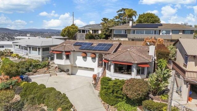 4331 Summit Dr, La Mesa, CA 91941 - view of front of home featuring a tiled roof, driveway, stairs, stucco siding, and solar panels