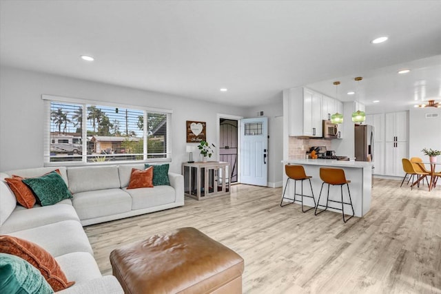 8394 Blue Lake Dr, San Diego, CA 92119 - living area with recessed lighting, light wood-style flooring, and visible vents