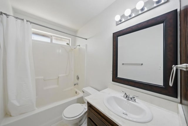 bathroom with vanity, shower / tub combo with curtain, and toilet
